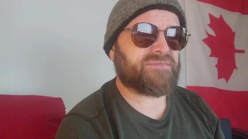 Rodney, a Brotherhood member, speaking to camera in his home
